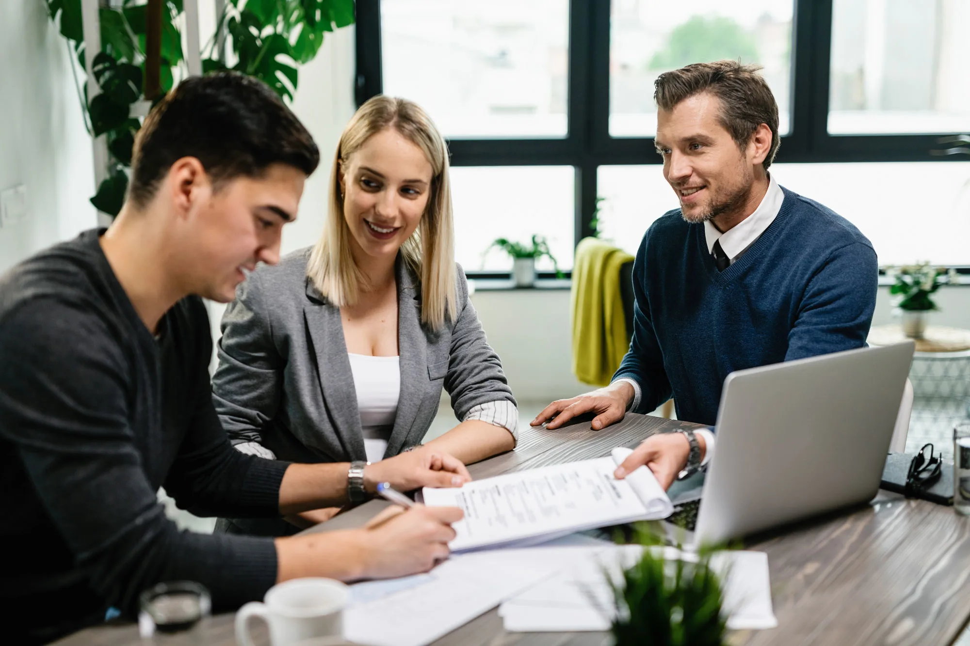 Professionals assisting with Thailand tax return filing for expats